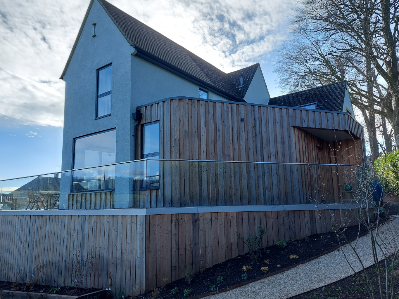flat roof timber clad extension cantilevered roof